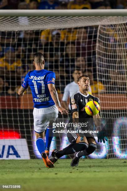 Edgar Mendez of Cruz Azul tries to score over Nahuel Guzman, goalkeeper of Tigres, during the 15th round match between Tigres UANL and Cruz Azul as...