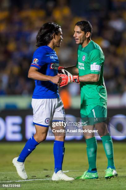 Jesus Corona, goalkeeper of Cruz Azul, talks to Gerardo Flores as he leaves the field after receiving a red card during the 15th round match between...