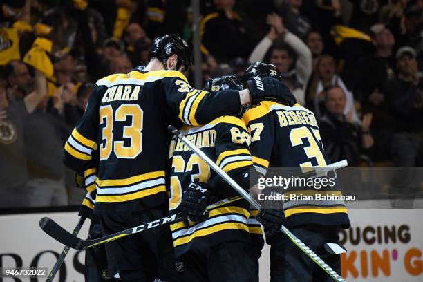 Zdeno Chara, Brad Marchand and Patrice Bergeron of the Boston Bruins celebrate a goal against the Toronto Maple Leafs during the First Round of the...