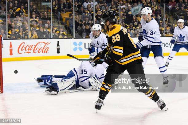 David Pastrnak of the Boston Bruins scores against the Toronto Maple Leafs during the First Round of the 2018 Stanley Cup Playoffs at the TD Garden...