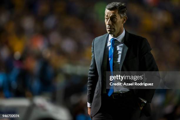 Pedro Caixinha, coach of Cruz Azul, gets out of the field after being expeled during the 15th round match between Tigres UANL and Cruz Azul as part...