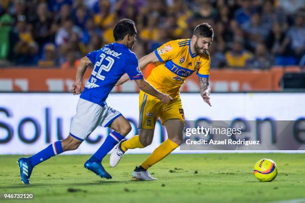 Andre-Pierre Gignac of Tigres fights for the ball with Rafael Baca of Cruz Azul during the 15th round match between Tigres UANL and Cruz Azul as part...