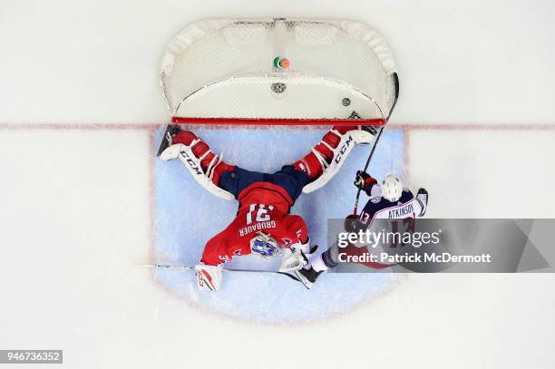 Cam Atkinson of the Columbus Blue Jackets scores a first period goal against Philipp Grubauer of the Washington Capitals in Game Two of the Eastern...