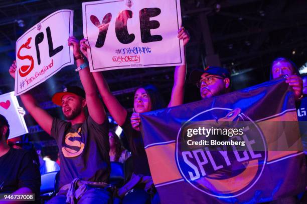 Fans hold placards and a banner in support of team Splyce during the grand final game between teams Tox and Splyce at the Halo World Championship...