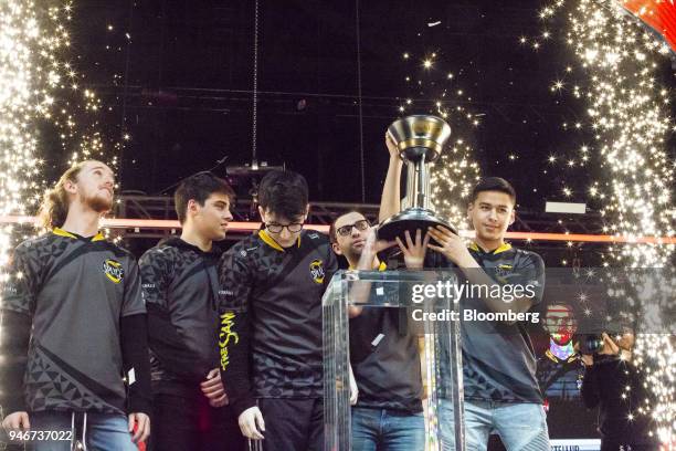 Members of team Splyce, from left to right, Braedon Boettcher, Jonathan Willette, Kevin Smith, Jon Dadi, and Anthony Cuevas-Castro stand on stage...