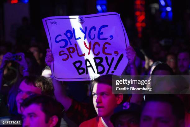 Fan holds a placard reading 'Splyce, Splyce, Baby!' during the grand final game between teams Tox and Splyce at the Halo World Championship finals in...