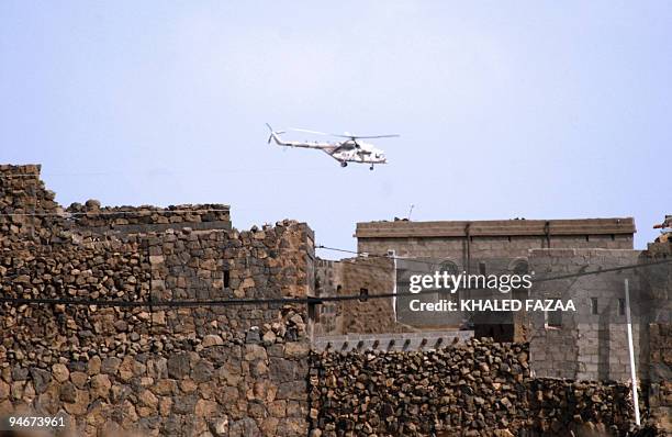 Yemeni army helicopter flies over the district of Arhab in the Sanaa province after security forces carried out operations against Al-Qaeda suspects...