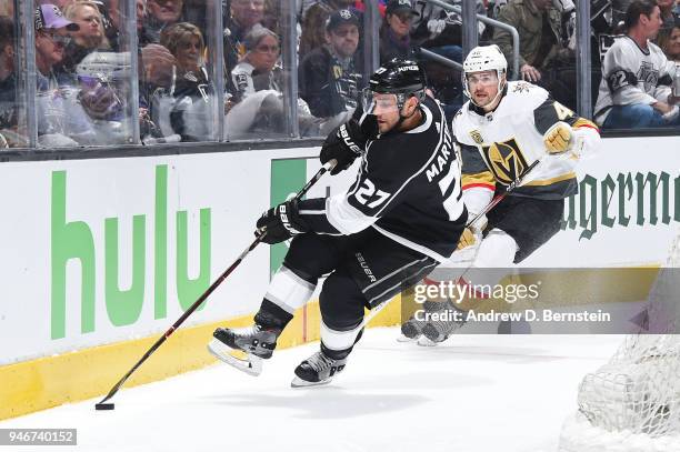 Alec Martinez of the Los Angeles Kings handles the puck against Ryan Carpenter of the Vegas Golden Knights in Game Three of the Western Conference...