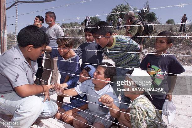Palestinian refugee in Lebanon from the Ain al-Helweh refugee camp Samer al-Rumi talks to his cousins living in Israel as he meets them for the first...