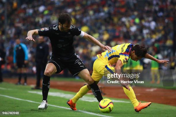 Jose Basanta of Monterrey struggles for the ball with Diego Lainez of America during the 15th round match between America and Monterrey as part of...
