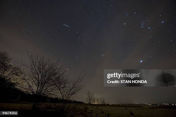 Meteor from the Geminids meteor shower enters the Earth's atmosphere on December 12, 2009 above Southold, New York. This meteor shower gets the name...