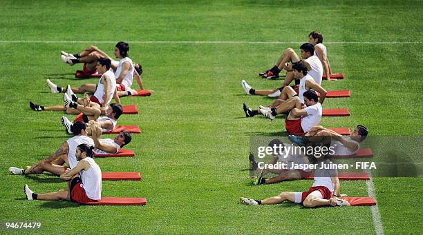 Estudiantes de La Plata players warm-up at the beginning of their training session on December 17, 2009 in Abu Dhabi, United Arab Emirates....