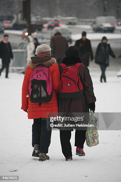 People walk in the snow in the Place De La Concorde on December 17, 2009 in Paris, France. Berlin, London and Paris have all recorded temperatures...