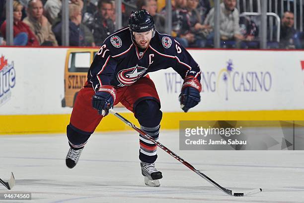 Forward Rick Nash of the Columbus Blue Jackets skates with the puck against the Nashville Predators on December 14, 2009 at Nationwide Arena in...