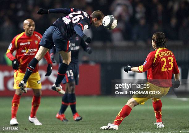 Paris' Christophe Jallet heads the ball next to Lens' Nenad Kovacevic during their French L1 football match Paris vs. Lens on December 16, 2009 at...