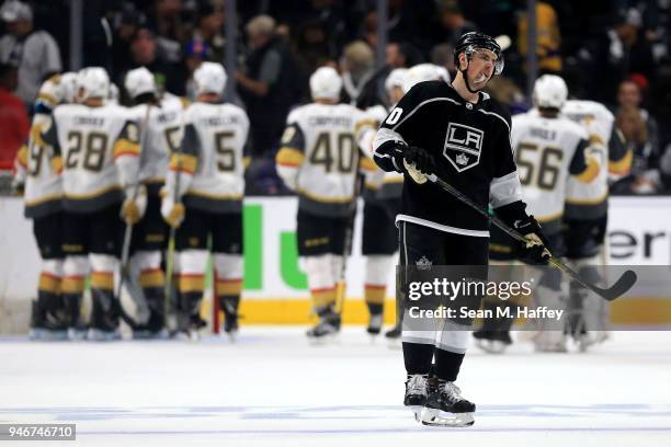 Tobias Rieder of the Los Angeles Kings looks on while the Vegas Golden Knights celebrate defeating the Los Angeles Kings 3-2 during Game Three of the...