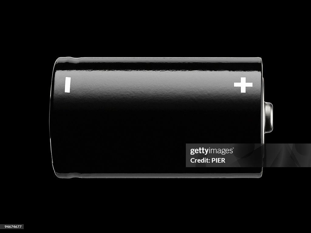 Large black battery, on black background