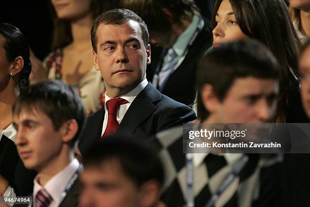 Russian President Dmitry Medvedev stands with students during a meeting at Moscow's Olympiisky Stadium on December. 17, 2009 in Moscow, Russia....