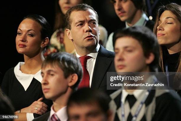 Russian President Dmitry Medvedev stands with students during a meeting at Moscow's Olympiisky Stadium on December. 17, 2009 in Moscow, Russia....