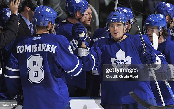 On December 14: Mike Komisarek of the Toronto Maple Leafs celebrates with teammate Alexei Ponikarovsky during the game against the Ottawa Senators...