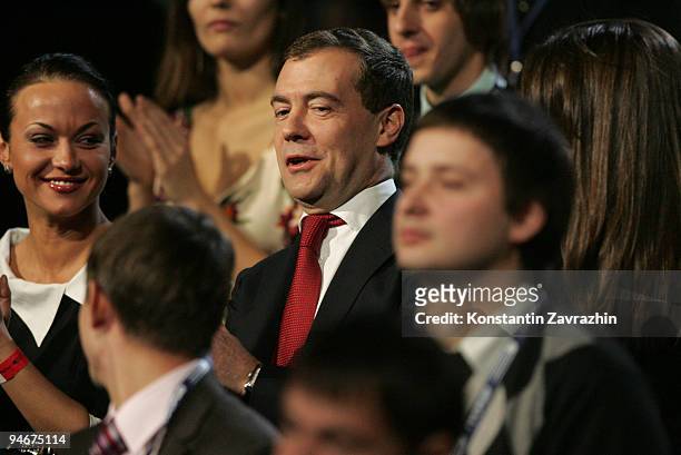 Russian President Dmitry Medvedev stands with students during a meeting at Moscow's Olympiisky Stadium on December. 17, 2009 in Moscow, Russia....