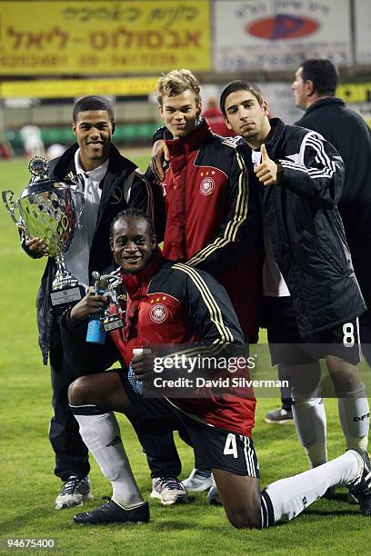 Players from the German Under-18 squad celebrate their victory after an international friendly match against Israel on December 17, 2009 in Kfar...