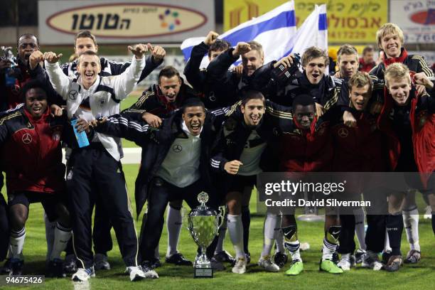 Players from the German Under-18 squad celebrate their victory after an international friendly match against Israel on December 17, 2009 in Kfar...