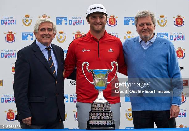 Jon Rahm of Spain poses with the trophy after winning the Open de Espana with Gonzaga Escauriaza and Inigo Mendez de Vigo during day four of Open de...