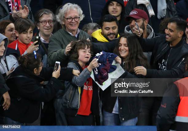 Kid becomes hysteric after Kylian Mbappe of PSG gave him his jersey following the Ligue 1 match between Paris Saint Germain and AS Monaco at Parc des...