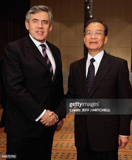 British Prime Minister Gordon Brown and Chinese Prime Minister Wen Jiabao shake hands as they prepare to hold bilateral talks in Copenhagen on...