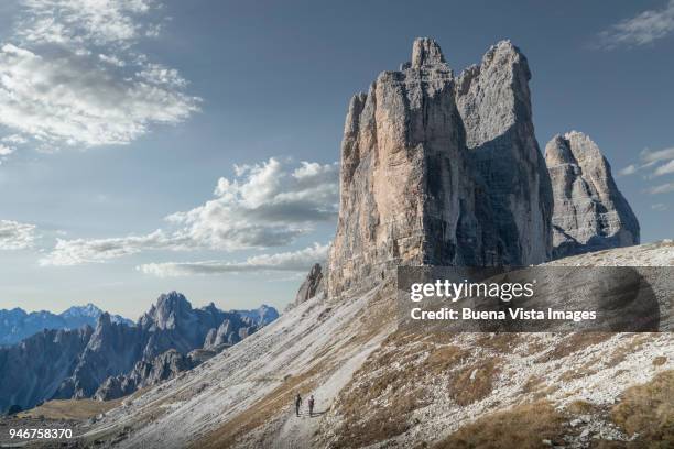 climbers on a mountain trail reaching rocky peaks. - be boundless summit stock pictures, royalty-free photos & images