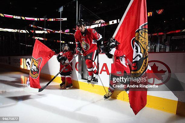 Chris Kelly of the Ottawa Senators steps onto the ice during player introductions prior to a game against the Montreal Canadiens at Scotiabank Place...