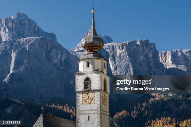 little church in a mountain village. - colfosco stock-fotos und bilder