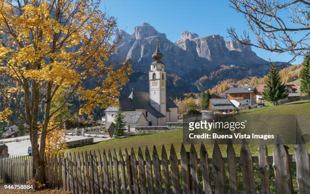 little church in a mountain village. - colfosco stock-fotos und bilder
