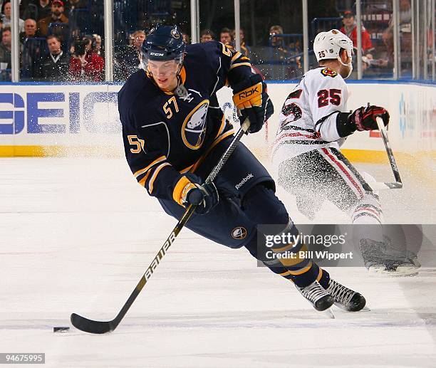 Tyler Myers of the Buffalo Sabres skates with the puck against the Chicago Blackhawks on December 11, 2009 at HSBC Arena in Buffalo, New York.