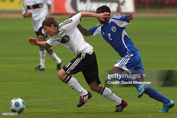 Germany's Denis Russ and Israel's Eli Dassa chase the ball during an International friendly match on December 17, 2009 in Kfar Saba, Israel. Germany...