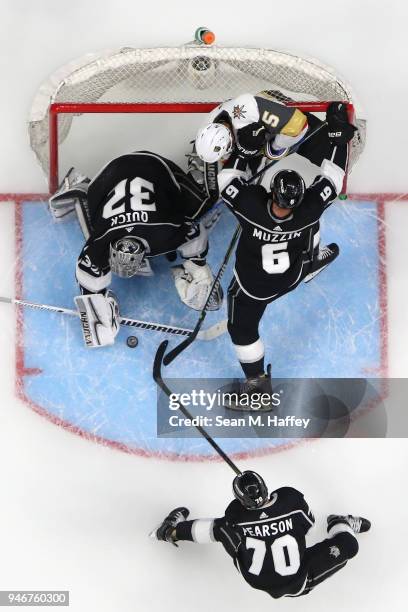 Tanner Pearson, Jonathan Quick and Jake Muzzin of the Los Angeles Kings defend against Deryk Engelland of the Vegas Golden Knights during the third...