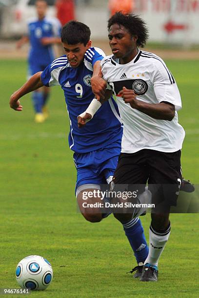 Hervenogi Unzola of Germany and Roei Kahat of Israel battle for the ball during an international friendly match on December 17, 2009 in Kfar Saba,...