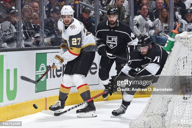 Torrey Mitchell of the Los Angeles Kings battles for the puck against Shea Theodore of the Vegas Golden Knights in Game Three of the Western...