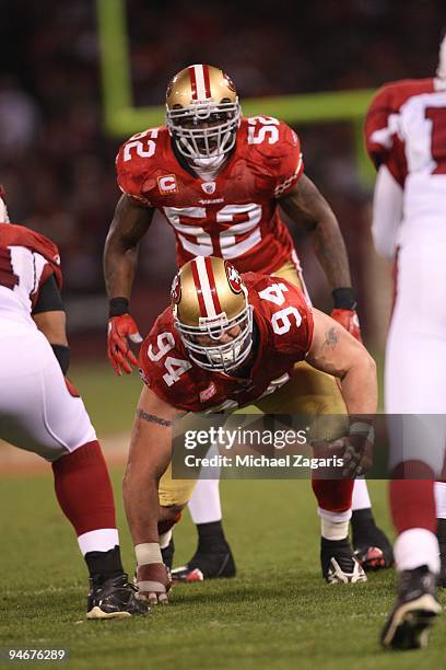 Patrick Willis and Justin Smith of the San Francisco 49ers at the line of scrimmage during the NFL game against the Arizona Cardinals at Candlestick...