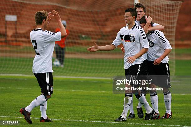 German players celebrate Denis Russ after he scores his team's first goal during an international friendly match on December 17, 2009 in Kfar Saba,...