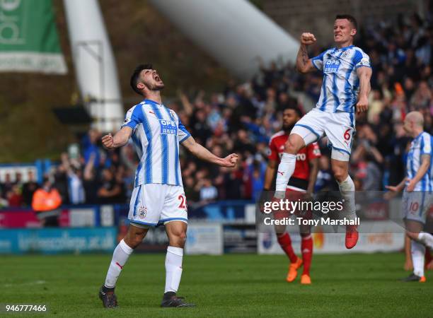 Christopher Schindler and Jonathan Hogg of Huddersfield Town celebrate their win at the final whistle during the Premier League match between...