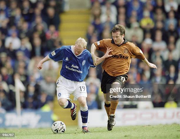 Andrew Johnson of Birmingham City holds off the challenge by Andy Sinton of Wolverhampton Wanderers during the Nationwide League Division One match...