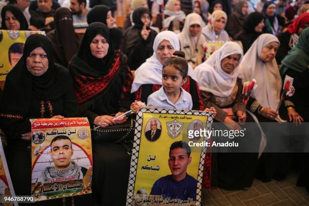 Girl holds a poster of a prisoner during a demonstration in support of the Palestinian prisoners in Israeli jails, in front of International...