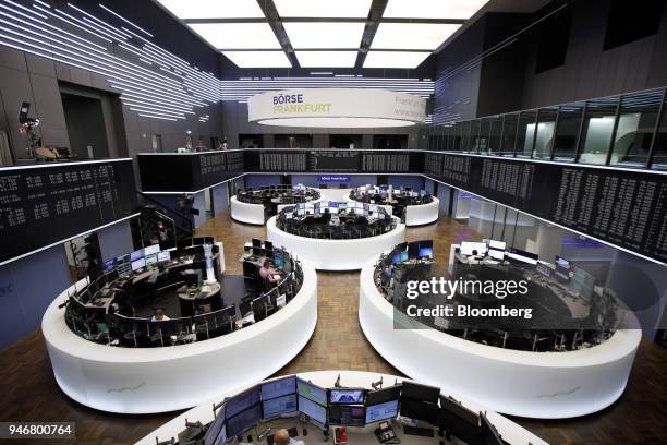 Traders monitor financial data inside the Frankfurt Stock Exchange, operated by Deutsche Boerse AG, in Frankfurt, Germany, on Monday, April 16, 2018....