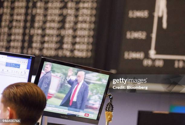 Television news report shows U.S. President Donald Trump inside the Frankfurt Stock Exchange, operated by Deutsche Boerse AG, in Frankfurt, Germany,...