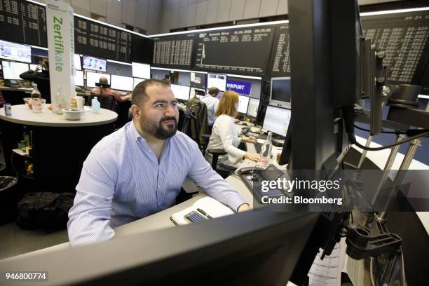 Traders monitor financial data inside the Frankfurt Stock Exchange, operated by Deutsche Boerse AG, in Frankfurt, Germany, on Monday, April 16, 2018....