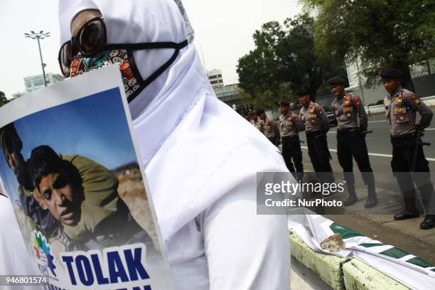 Dozen of representative from worker organization held a demonstration outside the US Embassy in Jakarta on Monday, April 16, 2018. Demonstrations...