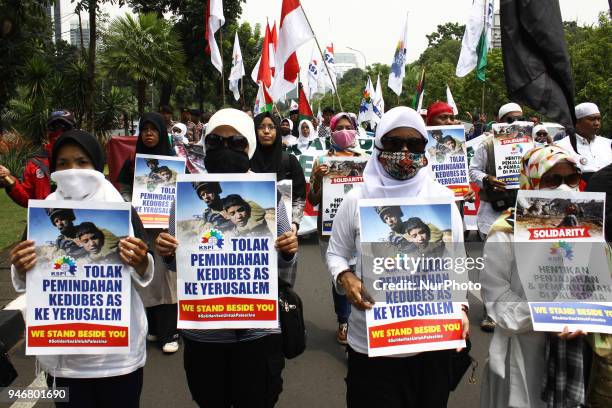 Dozen of representative from worker organization held a demonstration outside the US Embassy in Jakarta on Monday, April 16, 2018. Demonstrations...