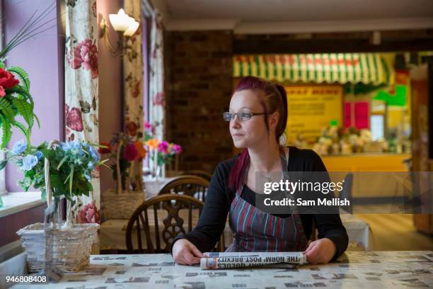 Waitress takes a break a the Farm Cafe in rural Holbeach on the 23rd June 2017 in Norfolk, United Kingdom. Established during the 1950s after the...